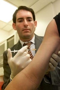A doctor administers a vaccine. Photo from: National Institues of Health